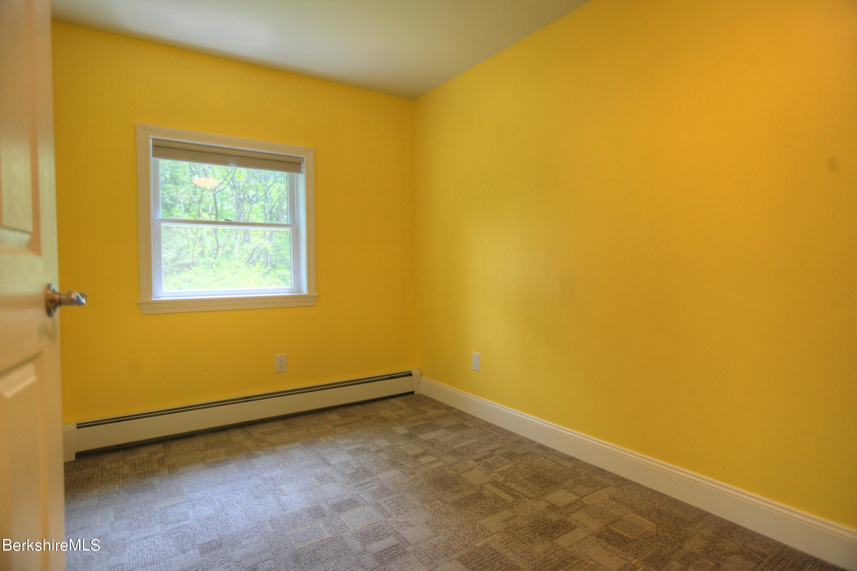 6 Roosterville Road Sandisfield, MA 01255 - Photo 20 of 35 a view of a small space with wooden floor and a window