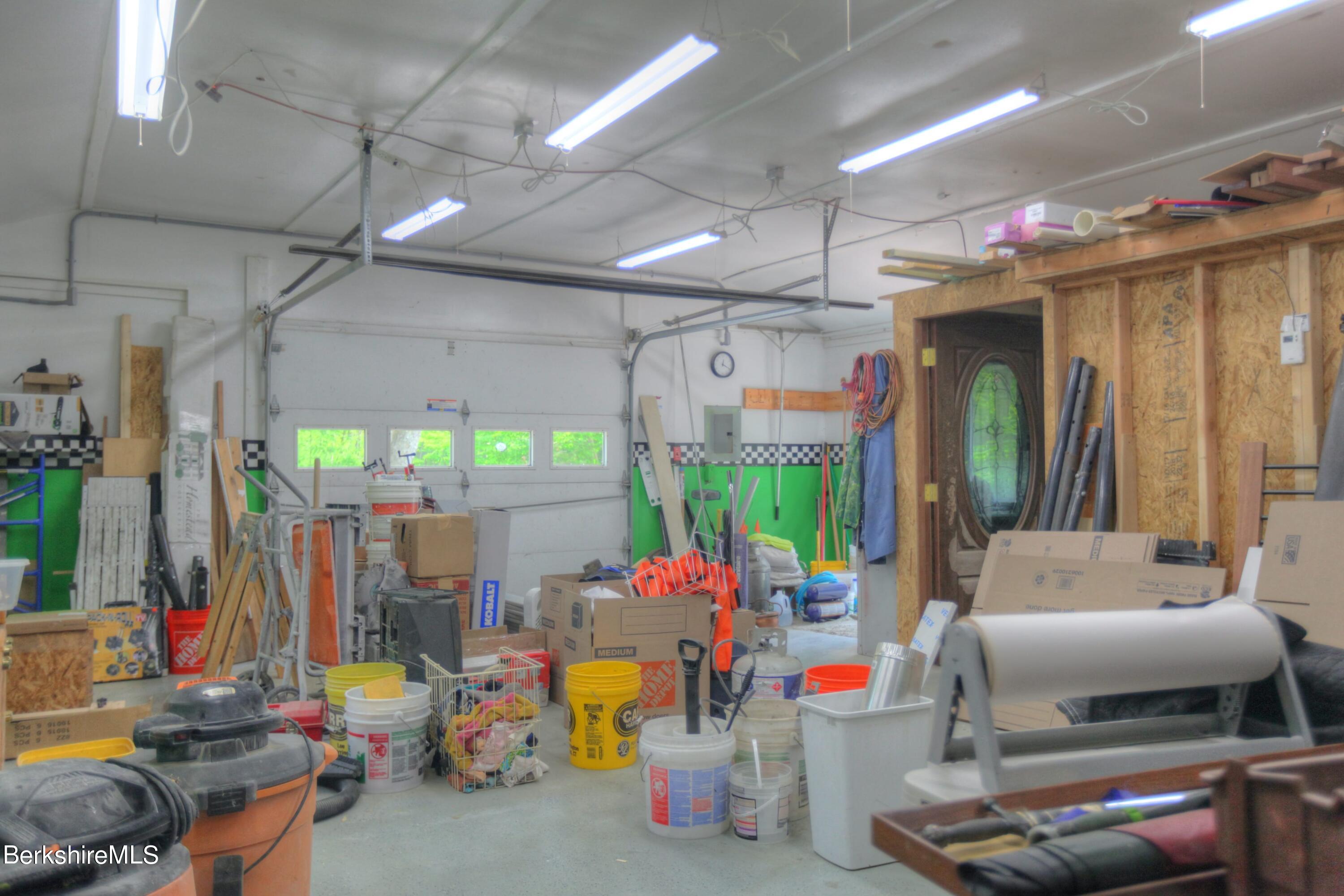 6 Roosterville Road Sandisfield, MA 01255 - Photo 31 of 35 a living room filled with furniture and a chandelier