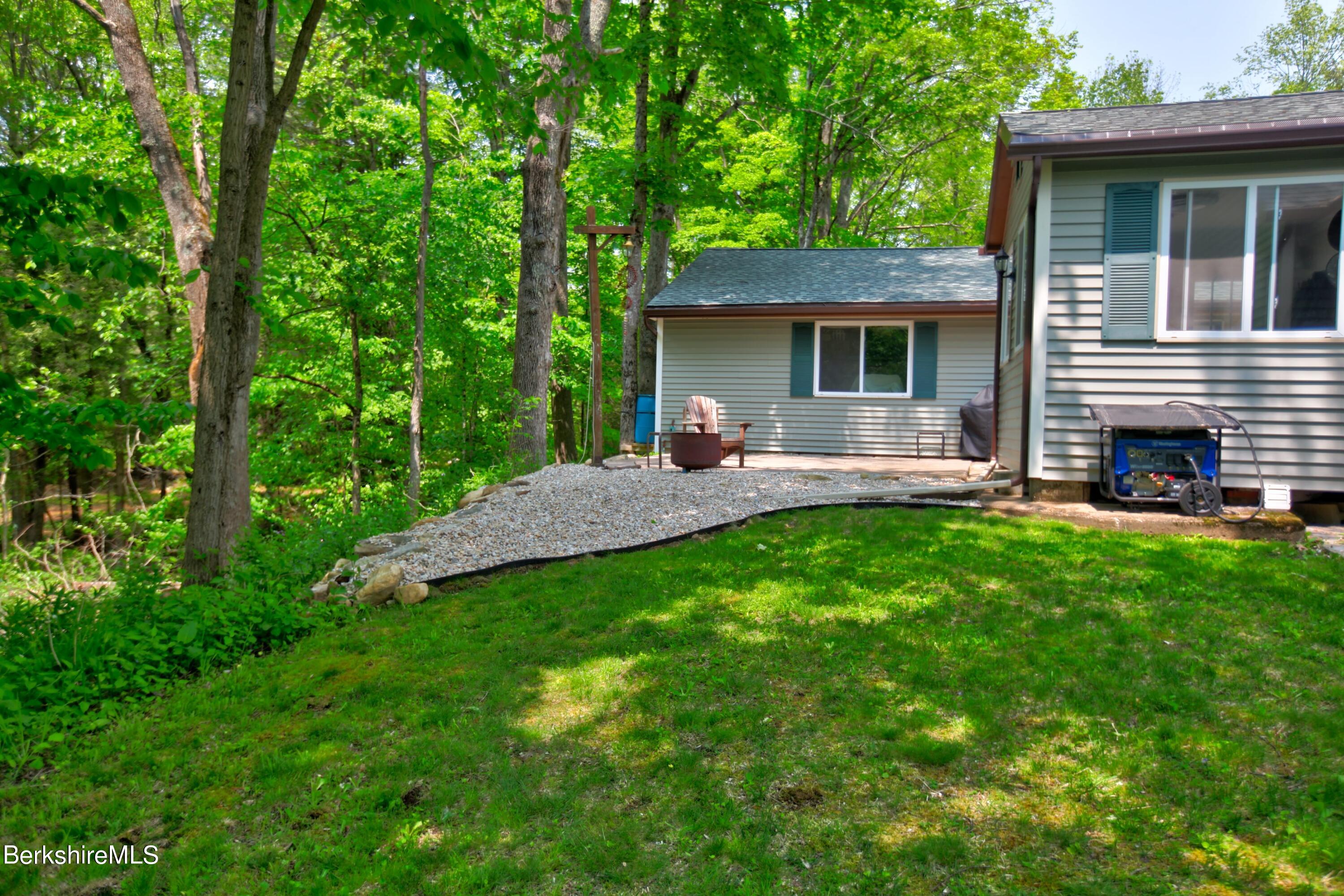 6 Roosterville Road Sandisfield, MA 01255 - Photo 34 of 35 a view of a house with a backyard and a patio