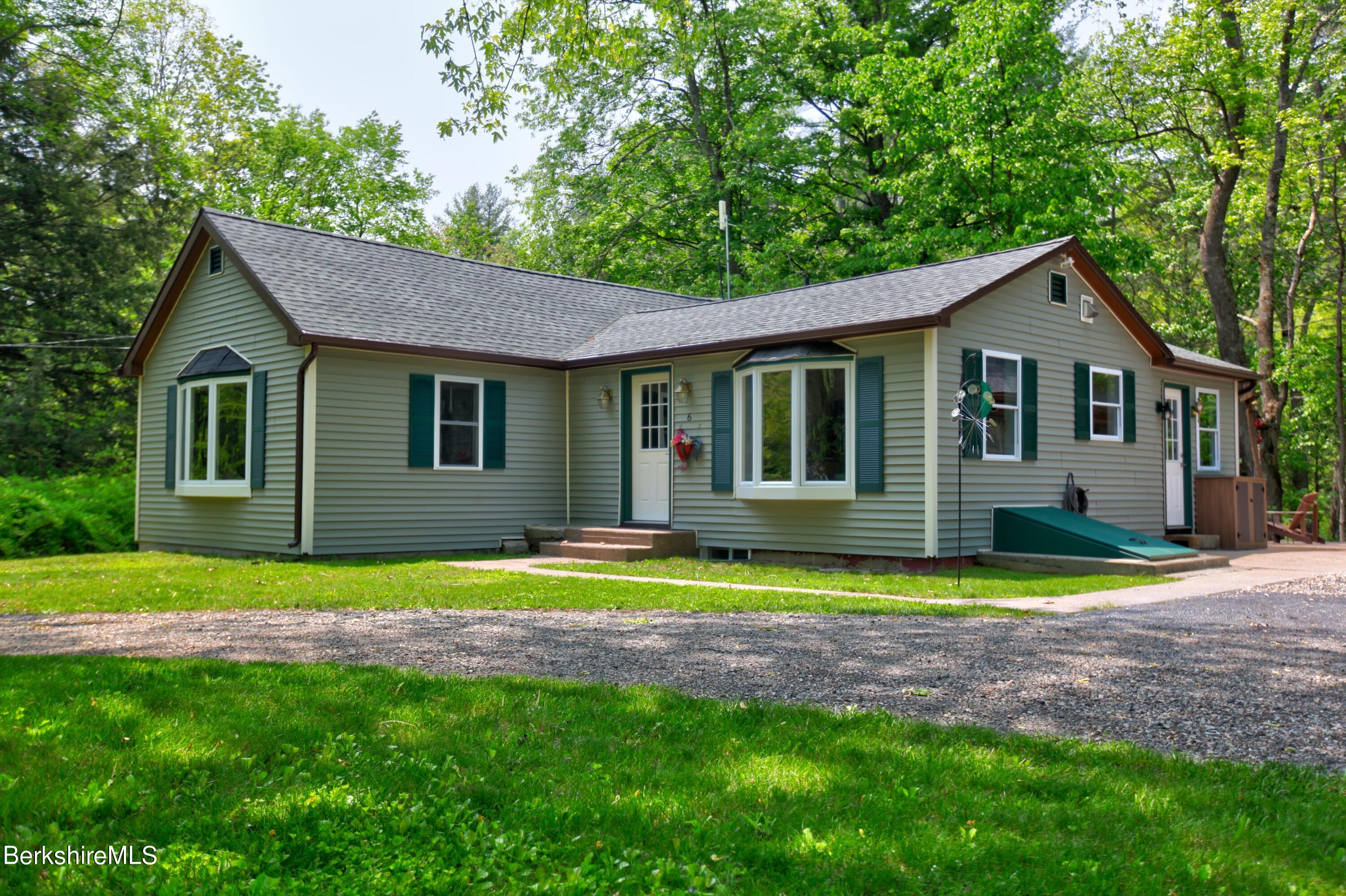 6 Roosterville Road Sandisfield, MA 01255 - Photo 6 of 35 a view of a house with a swimming pool