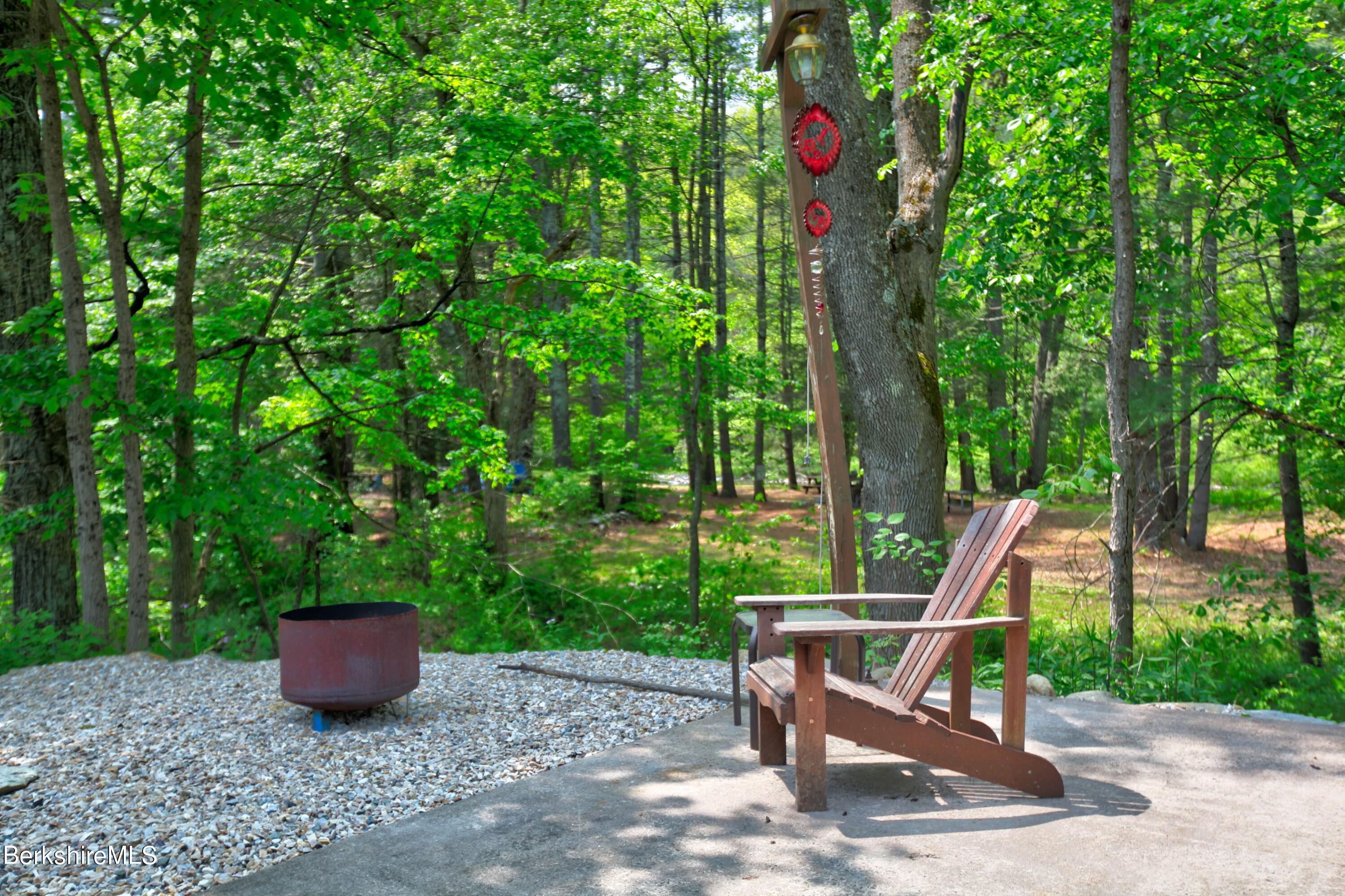 6 Roosterville Road Sandisfield, MA 01255 - Photo 7 of 35 a view of a sitting area with furniture and wooden fence