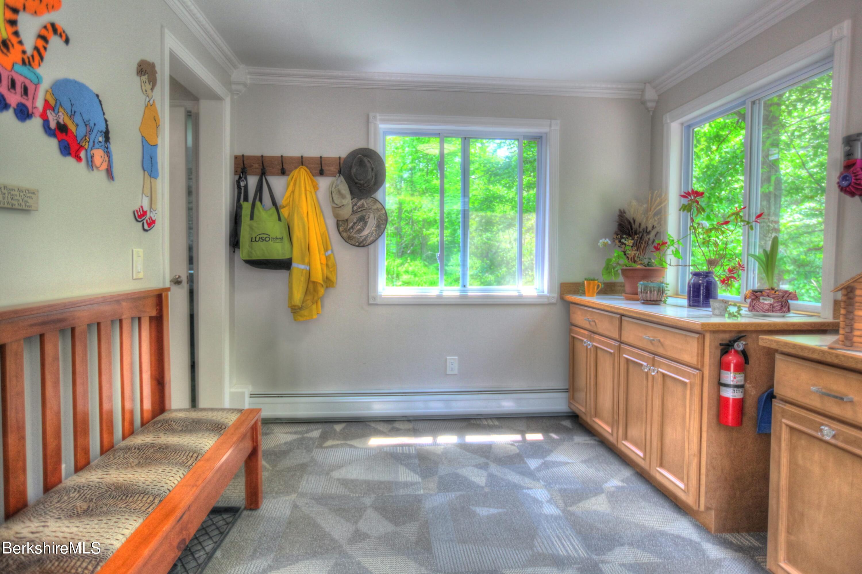 6 Roosterville Road Sandisfield, MA 01255 - Photo 9 of 35 a storage room with wooden floor and windows