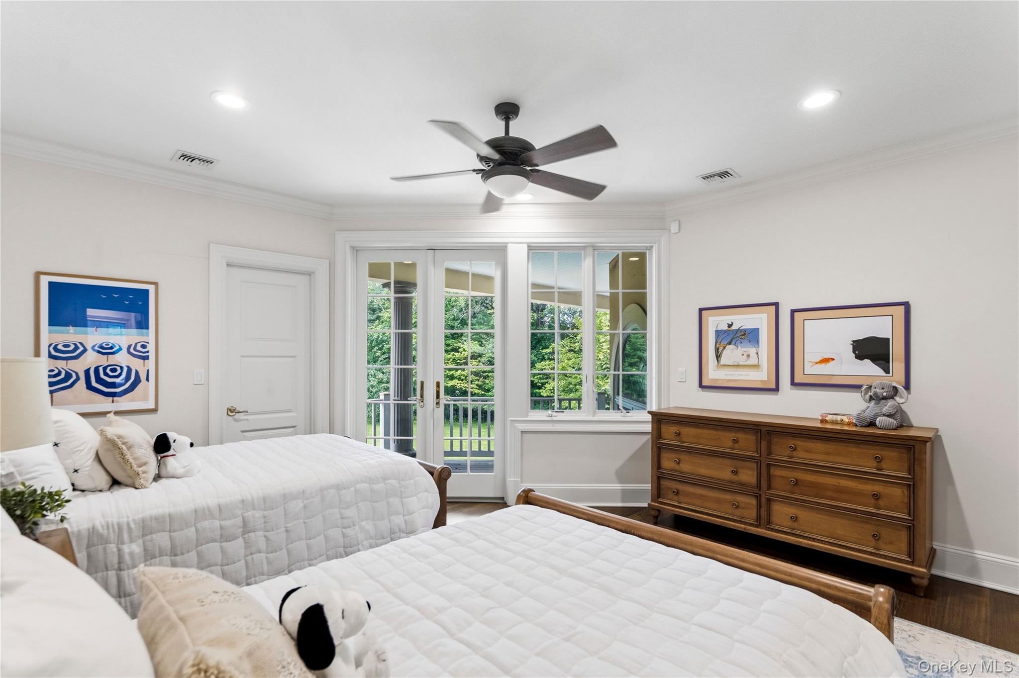 1960 Midlane Road South Syosset, NY 11791 - Photo 40 of 46 a bedroom with two beds and ceiling fan