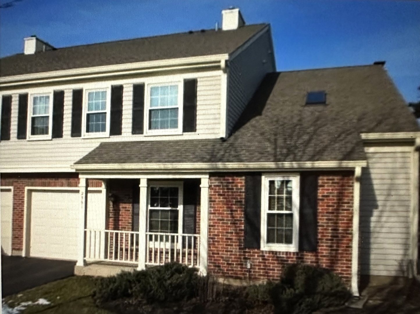 Undisclosed Address Schaumburg, IL 60173 - Photo 1 of 8 a front view of a house with a yard
