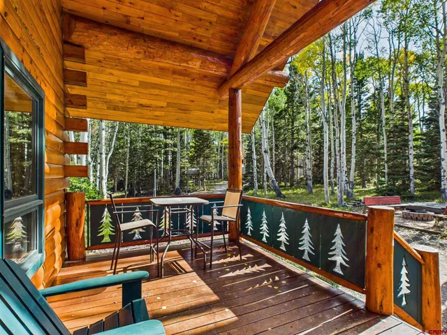 a view of a living room and chandelier