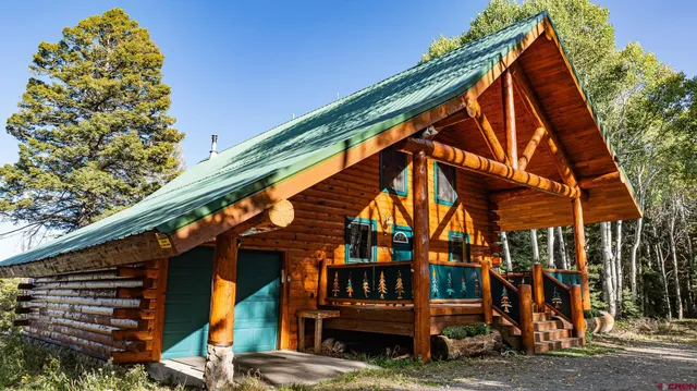 a view of a house with a small yard