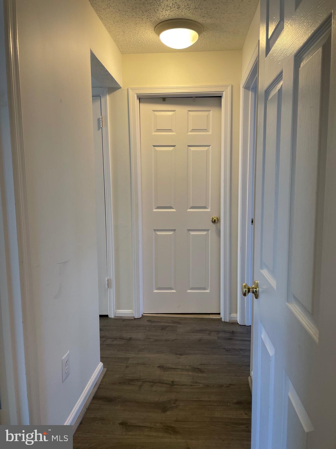 7000 Irwell Lane, Unit 11C Alexandria, VA 22315 - Photo 4 of 15 a view of room with wooden floor