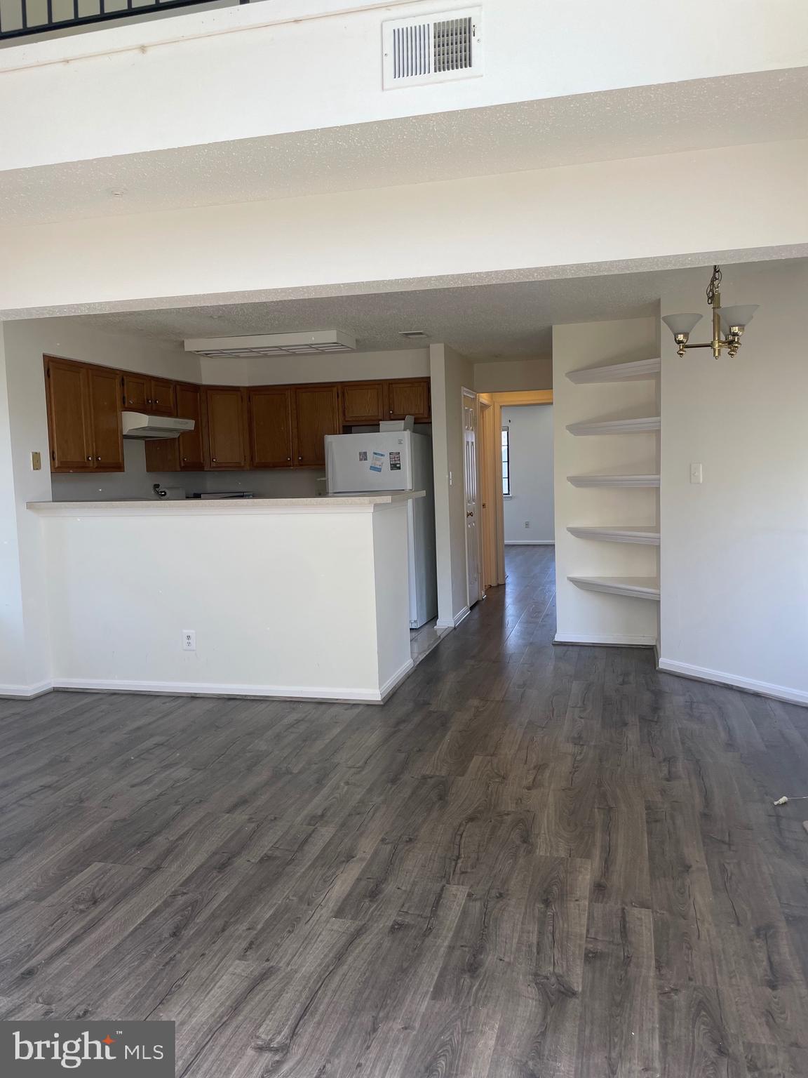 7000 Irwell Lane, Unit 11C Alexandria, VA 22315 - Photo 9 of 15 a view of walk in closet with clothes and shoes