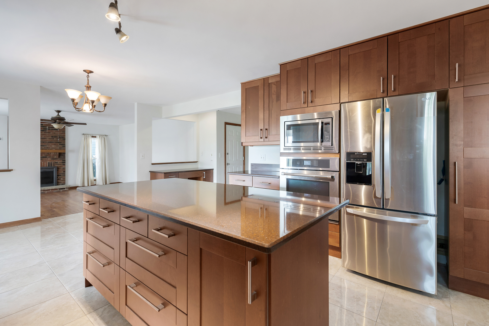 775 Harmon Boulevard Hoffman Estates, IL 60169 - Photo 5 of 27 a kitchen with kitchen island granite countertop a sink cabinets and stainless steel appliances