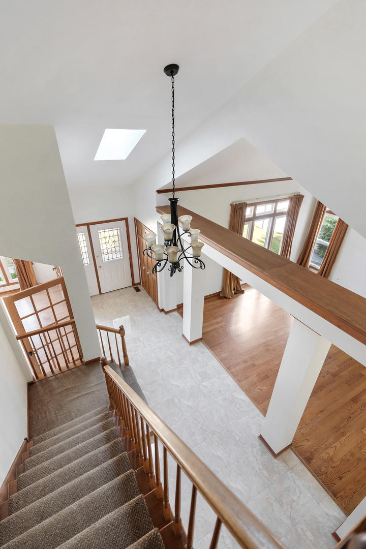 775 Harmon Boulevard Hoffman Estates, IL 60169 - Photo 9 of 27 a view of a livingroom with furniture and staircase