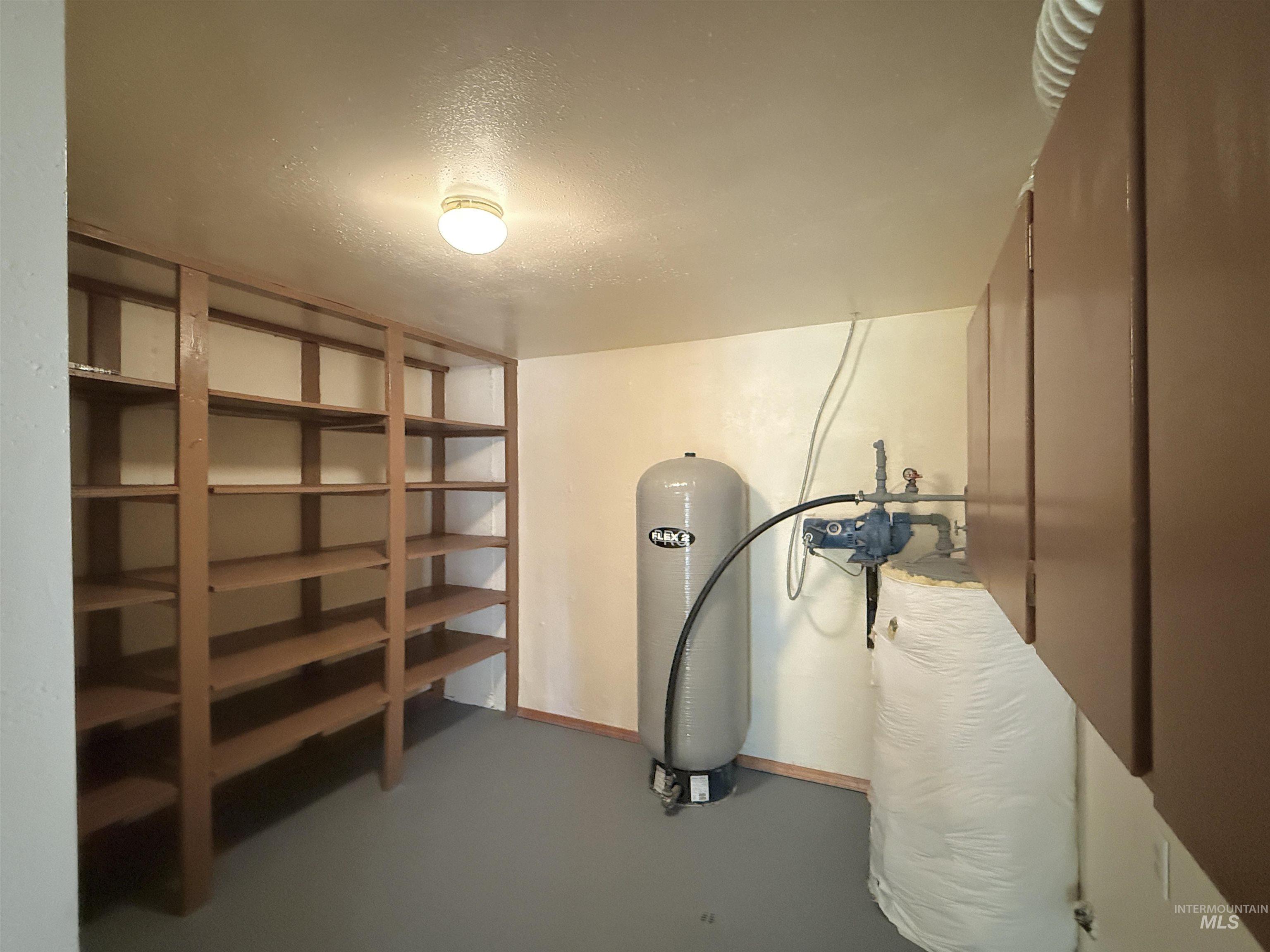 752 Mt Idaho Grade Road Grangeville, ID 83530 - Photo 18 of 29 Below grade area featuring a textured ceiling and a water pressure tank