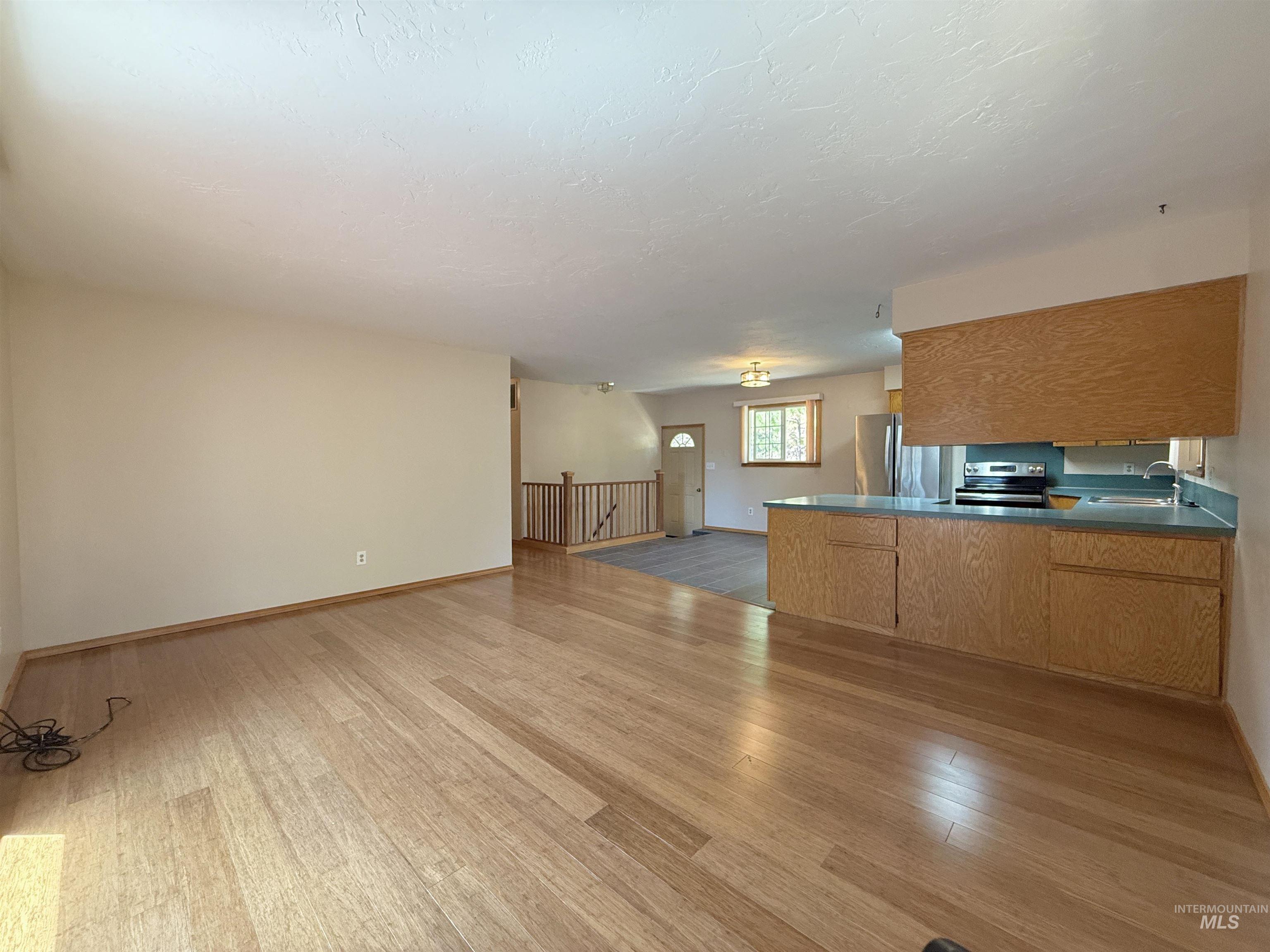 752 Mt Idaho Grade Road Grangeville, ID 83530 - Photo 6 of 29 Unfurnished living room featuring wood finished floors