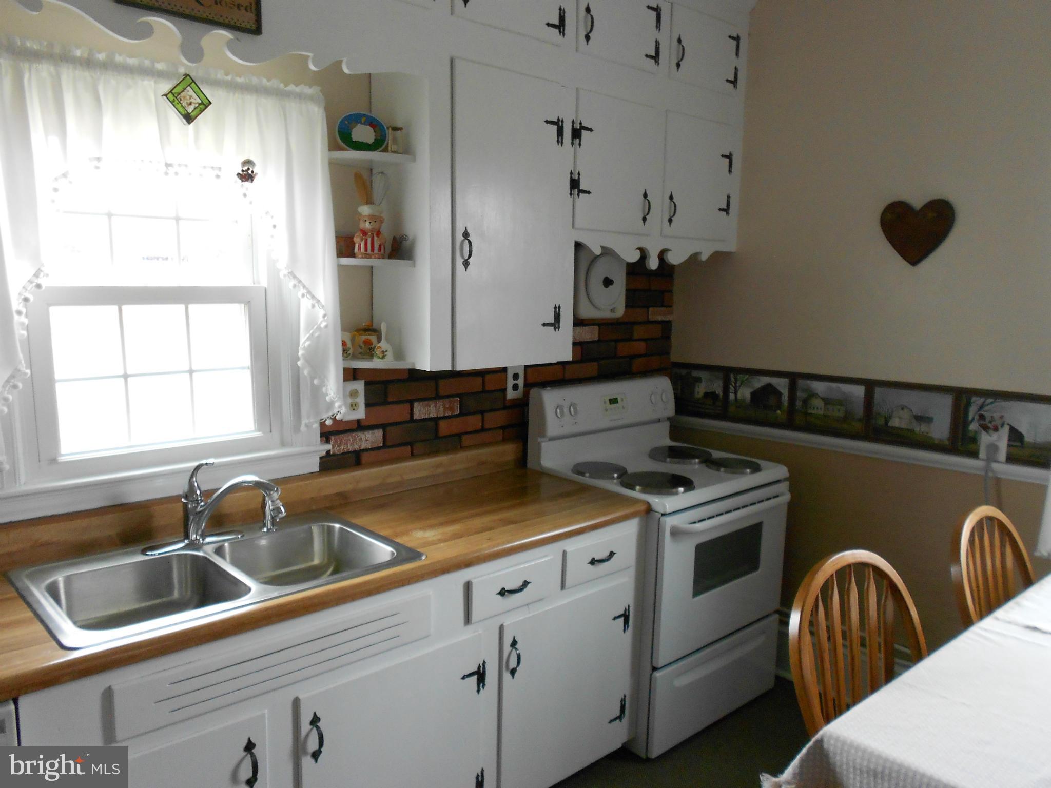14191 Goldvein Road Goldvein, VA 22720 - Photo 8 of 27 a kitchen that has a sink and a stove