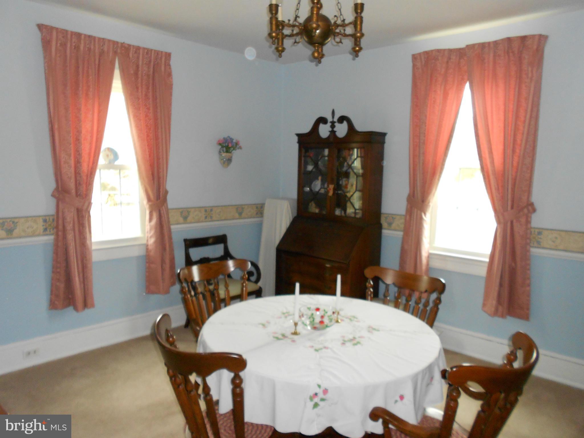 14191 Goldvein Road Goldvein, VA 22720 - Photo 10 of 27 a view of a dining room with furniture window and wooden floor
