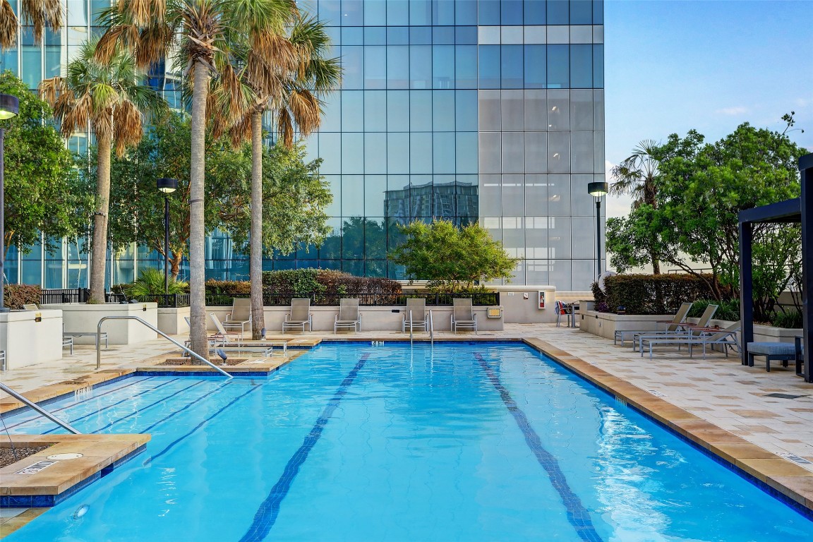360 Nueces Street, Unit 1116 Austin, TX 78701 - Photo 25 of 33 a swimming pool with outdoor seating and yard