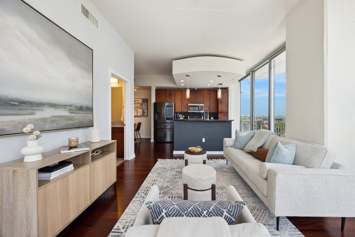 360 Nueces Street, Unit 1116 Austin, TX 78701 - Photo 3 of 33 a living room with furniture wooden floor and a large window