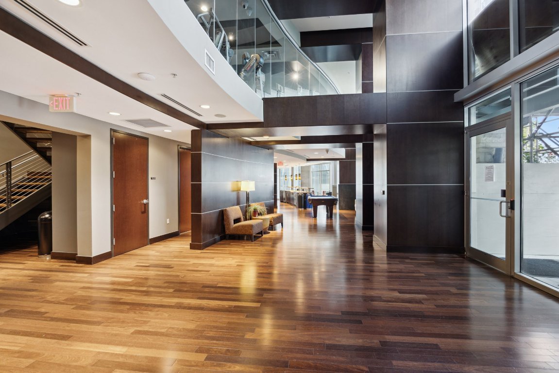 360 Nueces Street, Unit 1116 Austin, TX 78701 - Photo 30 of 33 a view of a hall with the wooden floor