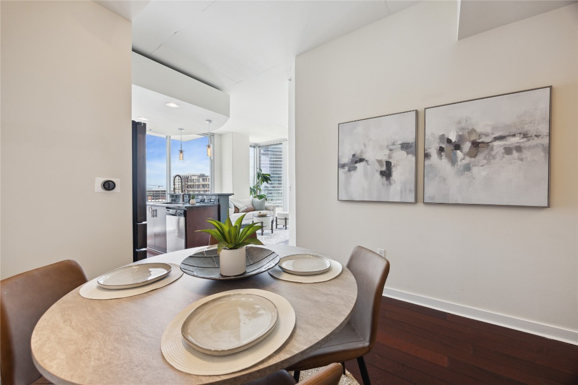 360 Nueces Street, Unit 1116 Austin, TX 78701 - Photo 8 of 33 a dining room with furniture and wooden floor
