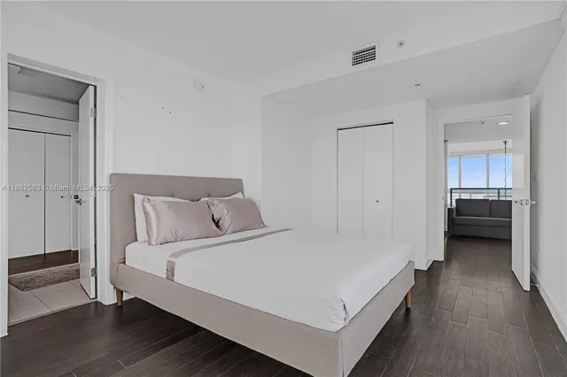 a bed room with a bed and a view