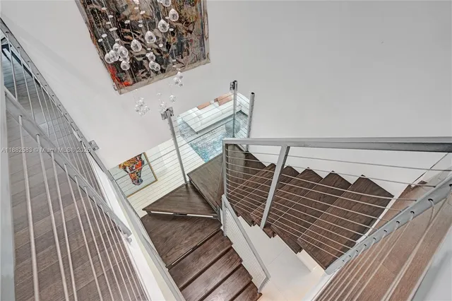 a view of a balcony with wooden floor