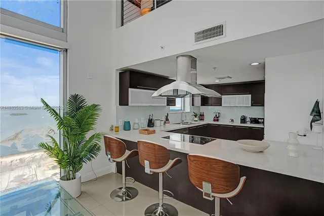 a kitchen with a table and chairs in it