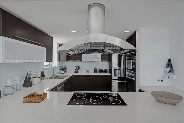 a kitchen with a stove a sink and a refrigerator