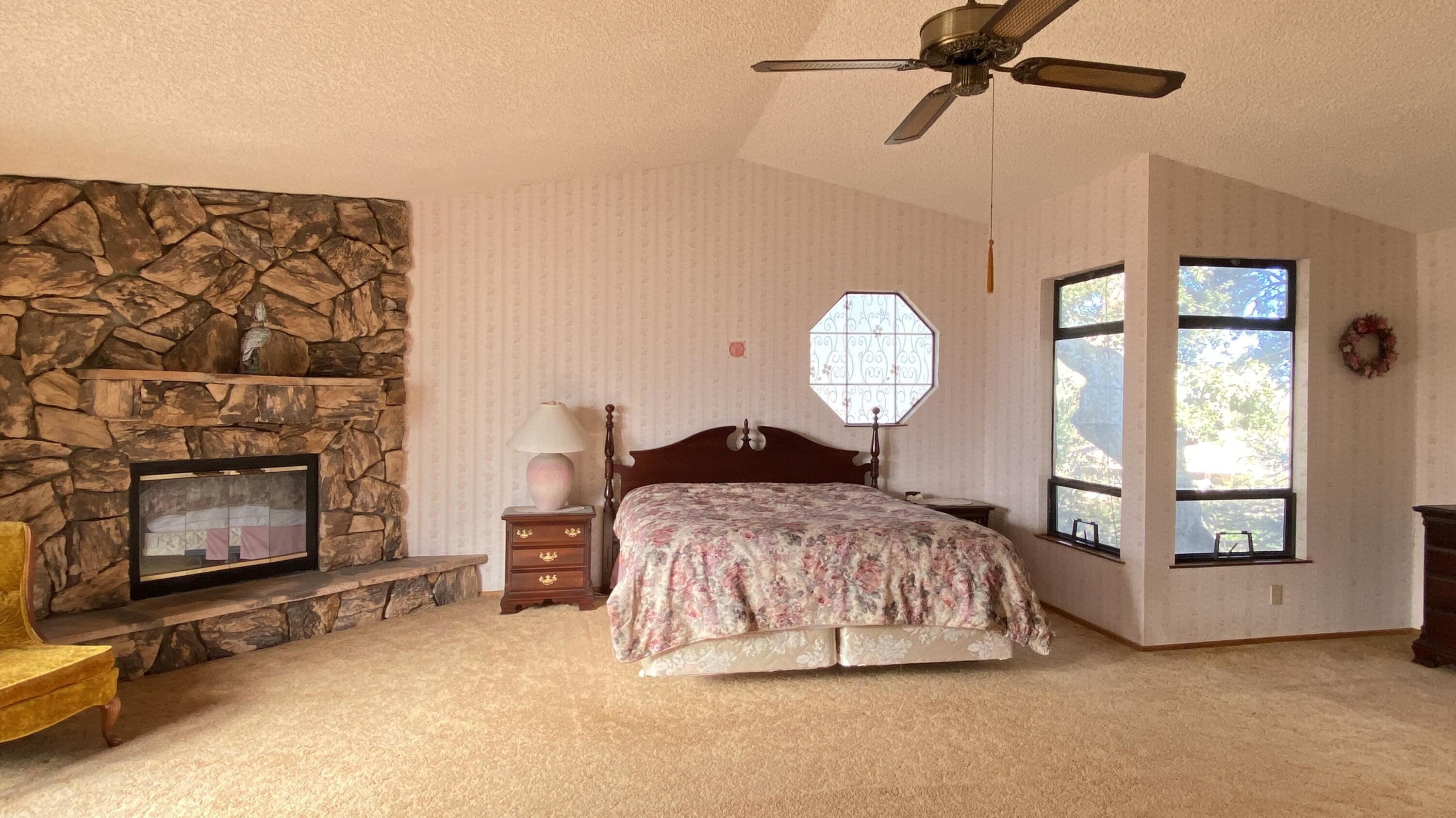 5355 Campbell Road Lompoc, CA 93436 - Photo 17 of 35 a bedroom with a bed and a chandelier