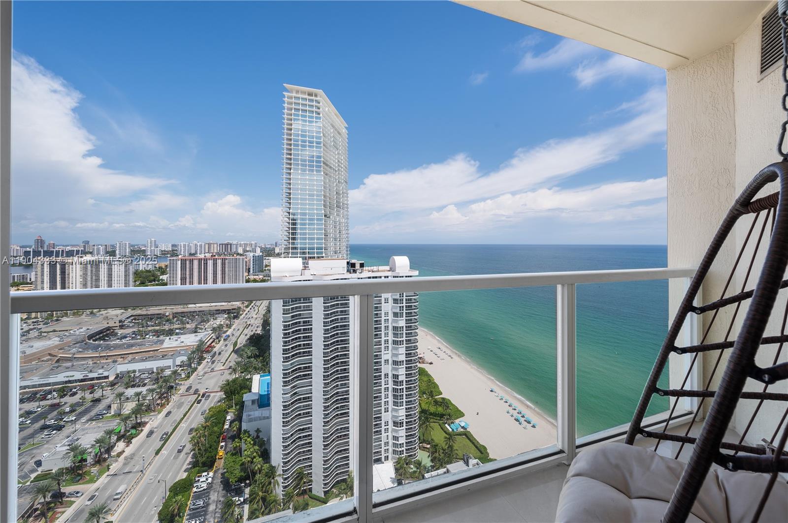 16699 Collins Avenue, Unit 3305 Sunny Isles Beach, FL 33160 - Photo 14 of 20 a view of buildings from a balcony