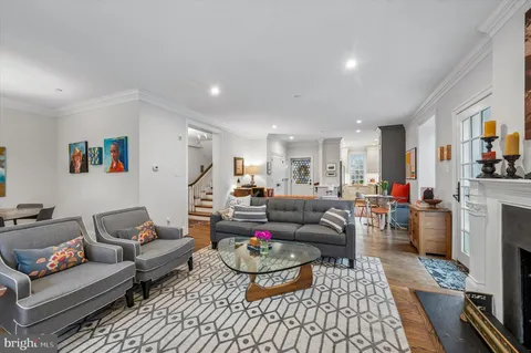 a living room with furniture and a rug