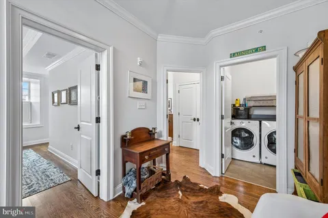 a view of a livingroom with furniture and hardwood floor