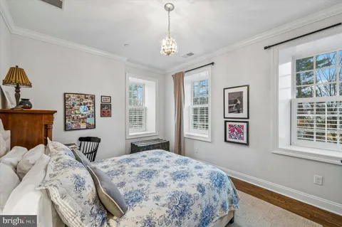 a bedroom with bed and window