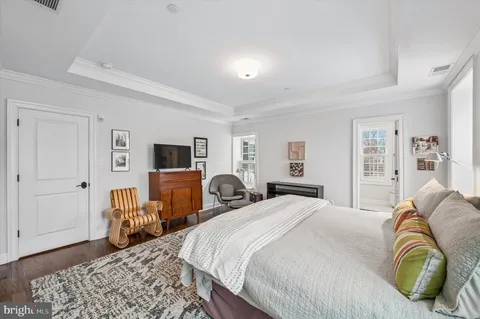 a bedroom with a bed and a couch