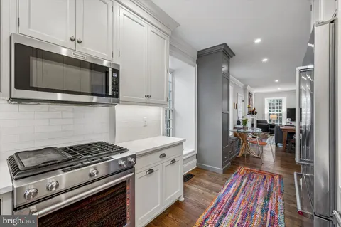 a kitchen with a stove and a microwave