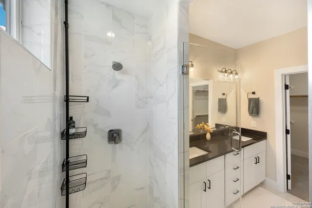 a utility room with dryer washer and a view of kitchen