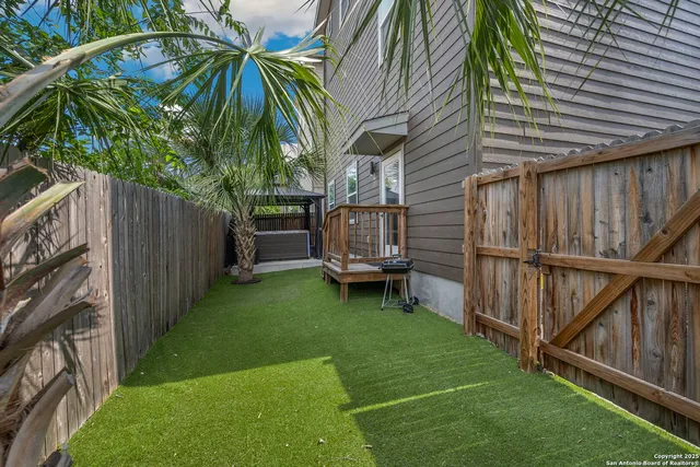 an aerial view of a house with roof deck