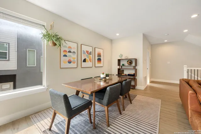 a kitchen with stainless steel appliances granite countertop a sink and a wooden floors