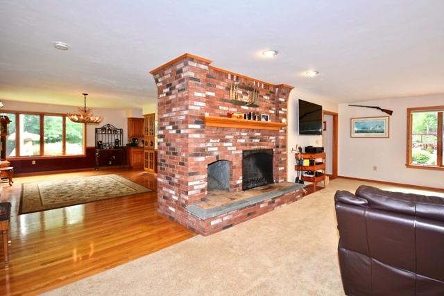 70 Parlowtown Road Rochester, MA 02770 - Photo 8 of 29 a living room with furniture and a fireplace