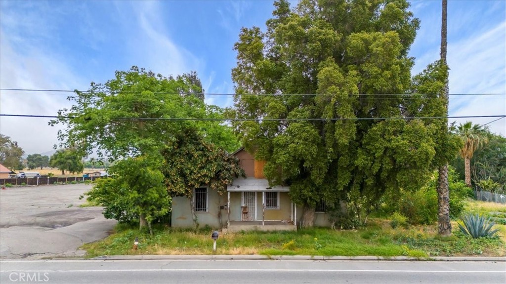 1044 Main Street Riverside, CA 92501 - Photo 1 of 1 a front view of a house with a yard