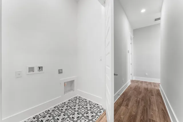 a view of a hallway with stairs