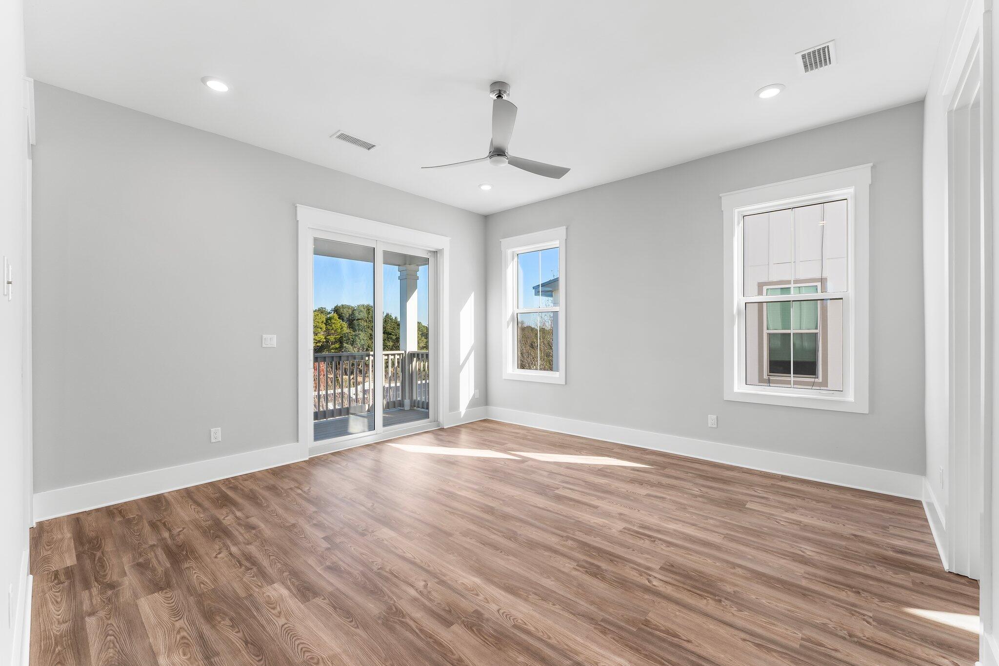 28 West Queen Palm Dr Inlet Beach Inlet Beach, FL 32461 - Photo 41 of 72 a view of an empty room with wooden floor and a window