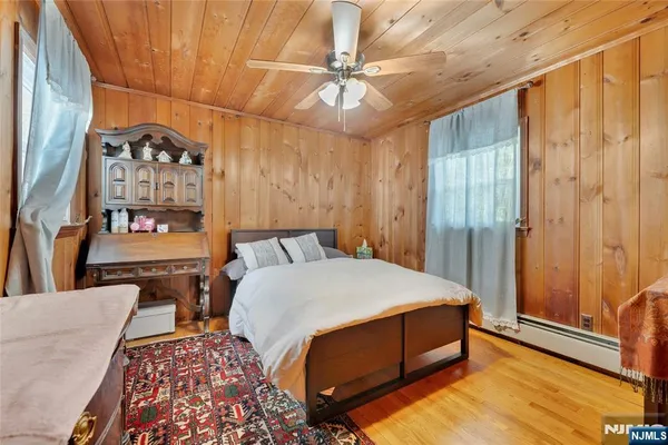 a room with a bed and a chandelier