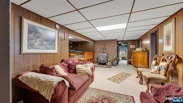 a living room with furniture a couch and a window