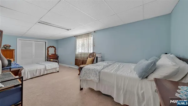 a bedroom with a bed and couch