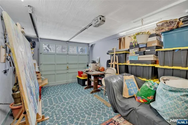 a view of a patio with couches table and chairs and potted plants