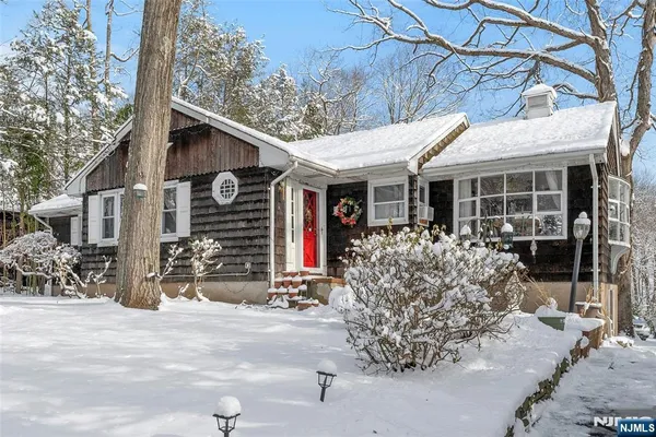 a view of a town with snow on the road