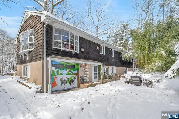 a view of a patio with table and chairs and potted plants