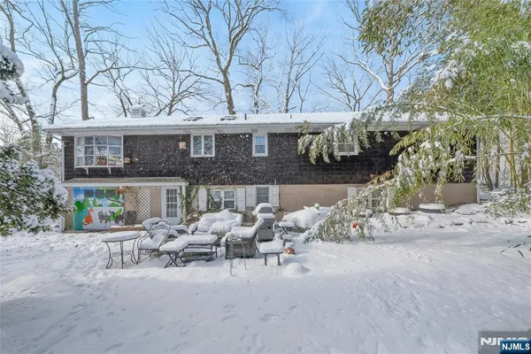 a view of a chairs and table in a patio