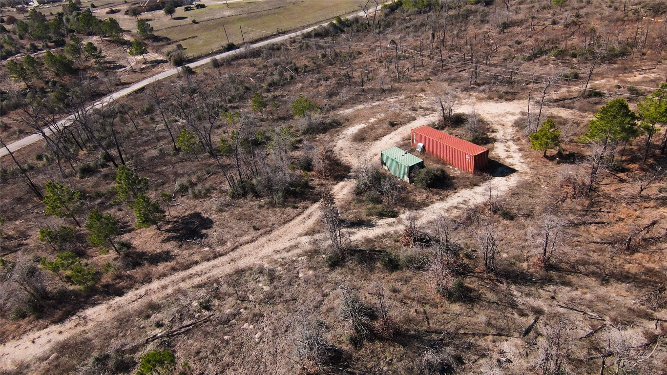 488 Kelley Road East Bastrop, TX 78602 - Photo 34 of 36 a view of a dry yard with lots of bushes