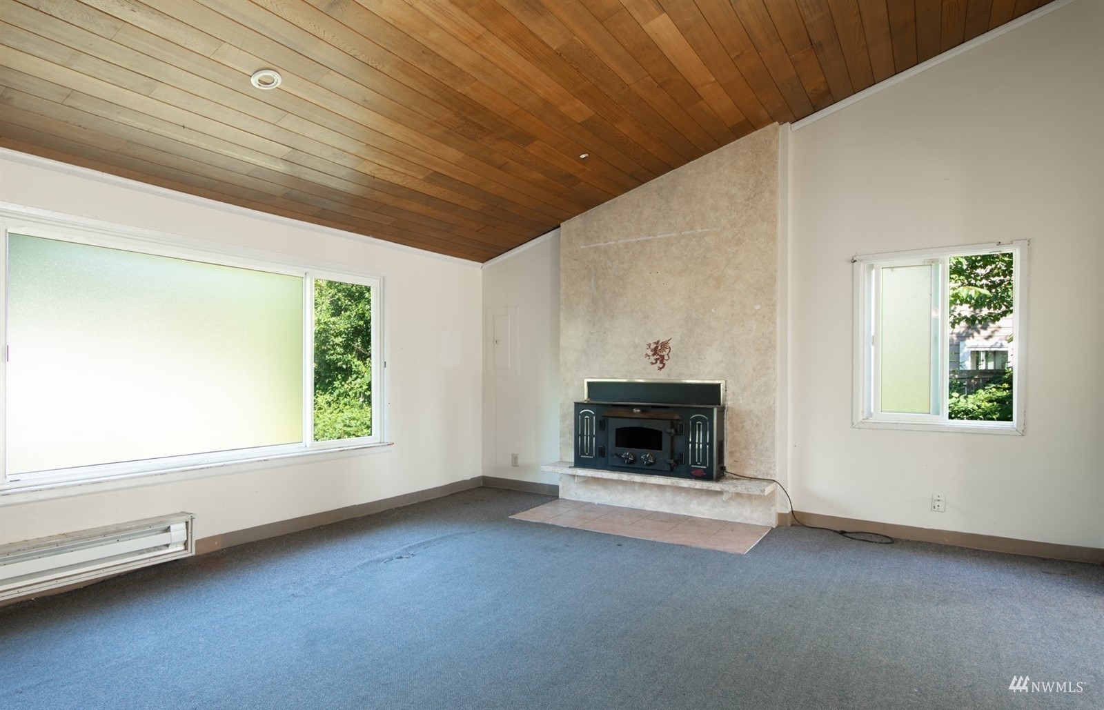 11919 East Gibson Road Everett, WA 98204 - Photo 9 of 27 a view of empty room with a fireplace and window