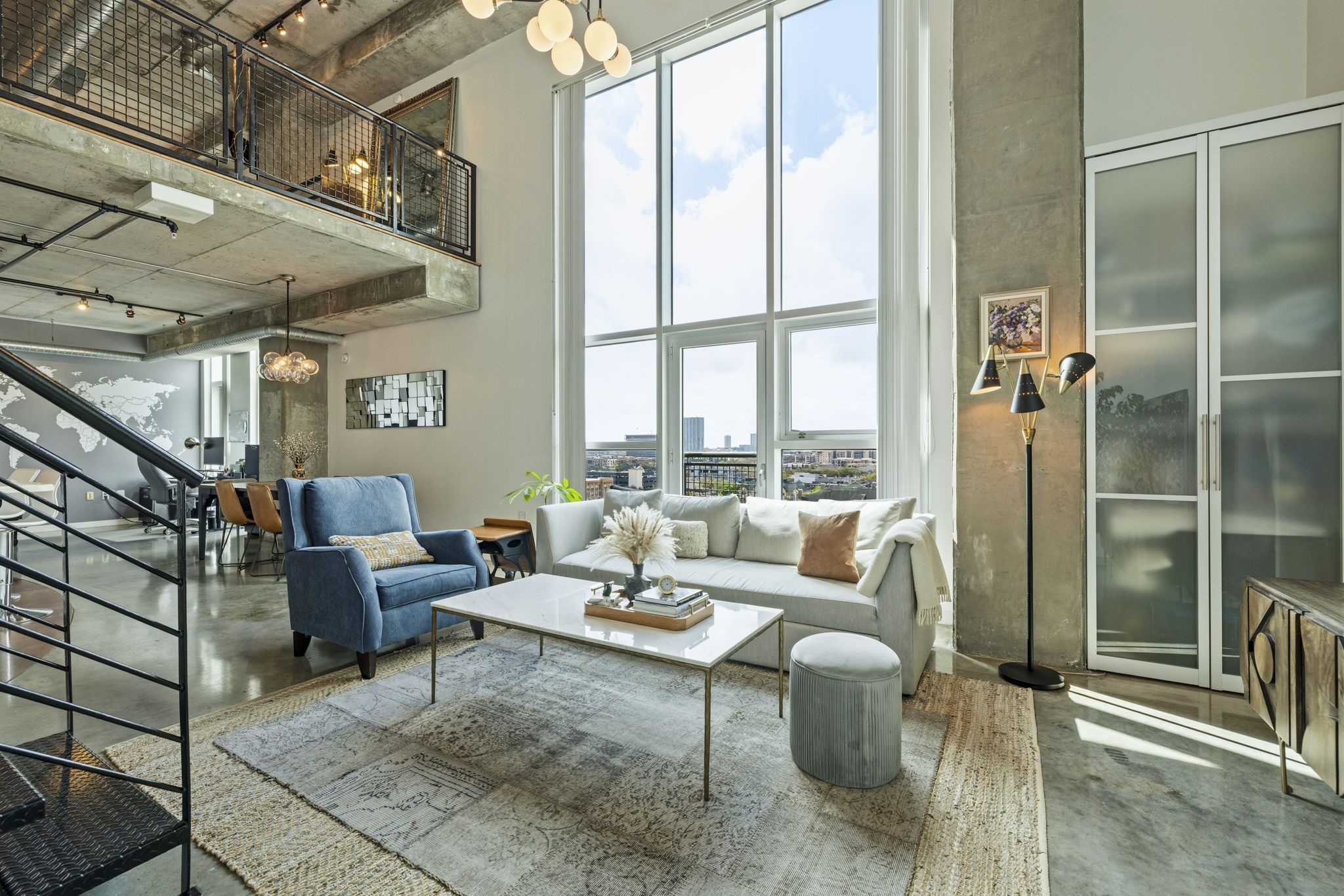 2000 Bagby Street, Unit 11415 Houston, TX 77002 - Photo 3 of 35 Relax in the living area while taking in beautiful sunset views. This unit views over the Medical Center and Galleria area.